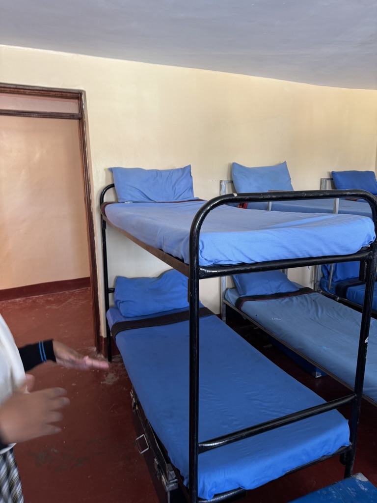 Bunk beds made up in a KGSA student dormitory