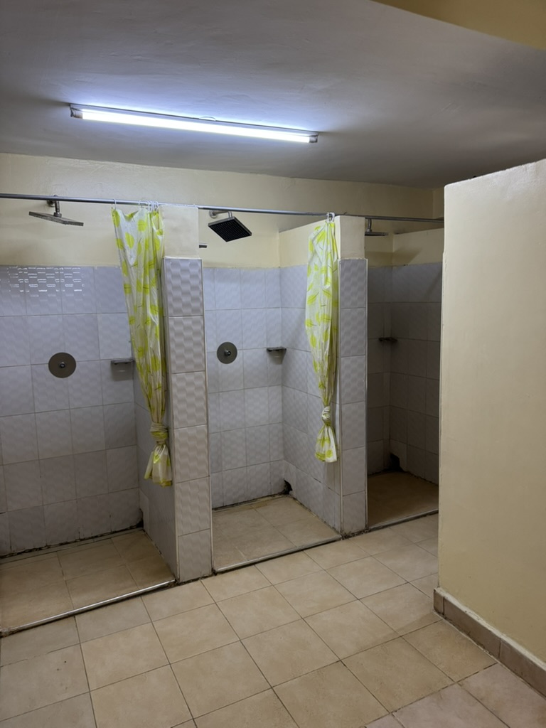 Tiled shower stalls in the KGSA student washrooms