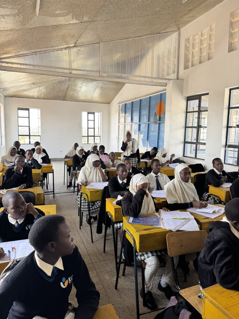 KGSA students at their desks during a lesson in a bright classroom